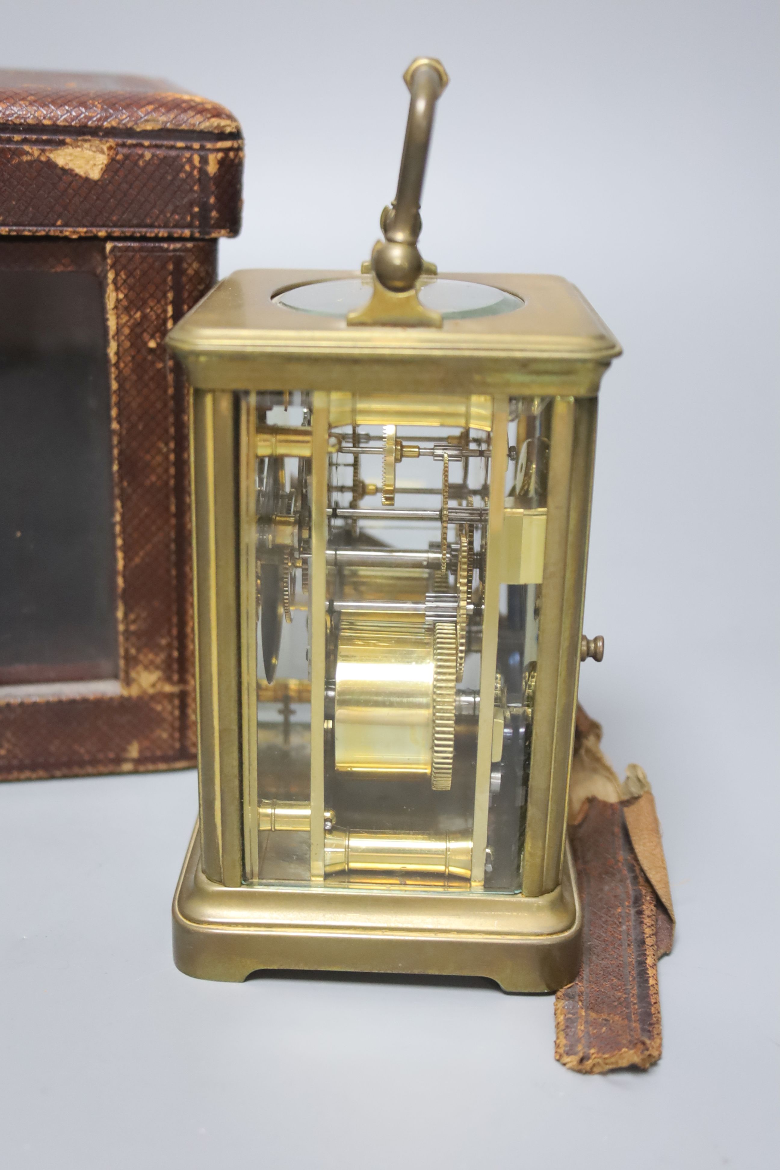 An early 20th century French lacquered brass carriage clock, with enamelled dial, cased, overall height 16cm